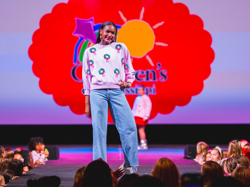 Children's of Mississippi patient Erin Randall is ready to deck the halls in a wreath-themed top.