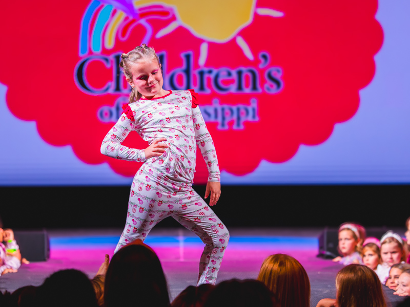 Children's of Mississippi patient Ila Helm shows pajamas perfect for Christmas morning.