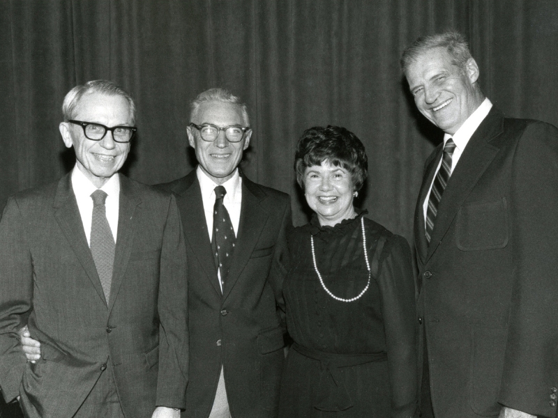 In this undated photo, four members of the original faculty and staff at UMMC reunite. They are, from left: Dr. Peter Blake, the first director of the Introduction to Clinical Medicine course; Dr. Orlando Andy, first head of the Department of Neurosurgery; Irene Graham, UMMC's first librarian; and Dr. Warren Bell, chair of what was then a separate administrative unit: the Department of Clinical Laboratory Sciences, for Clinical Pathology.