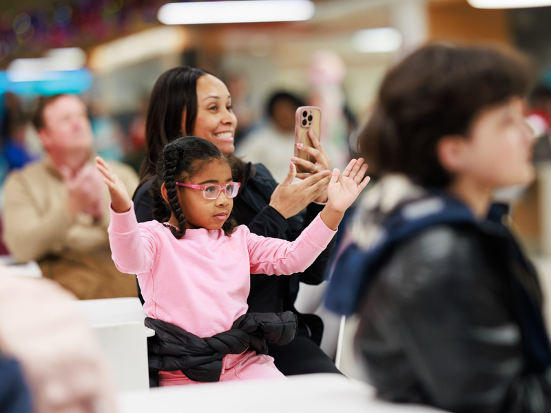Priyah Hope Austin and mom, Siedah Austin, cheer on Presley Grace Austin, who played "Marie" in the performance of the Nutcracker at Children's of Mississippi Light-a-Light event. Joe Ellis/ UMMC Communications