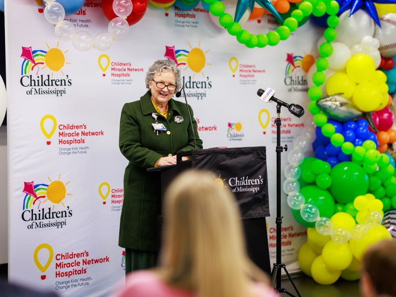 Ellen Hansen, chief nursing and operations officer for Children's of Mississippi congratulates Porter Antici, 2026 children's miracle network of Mississippi.