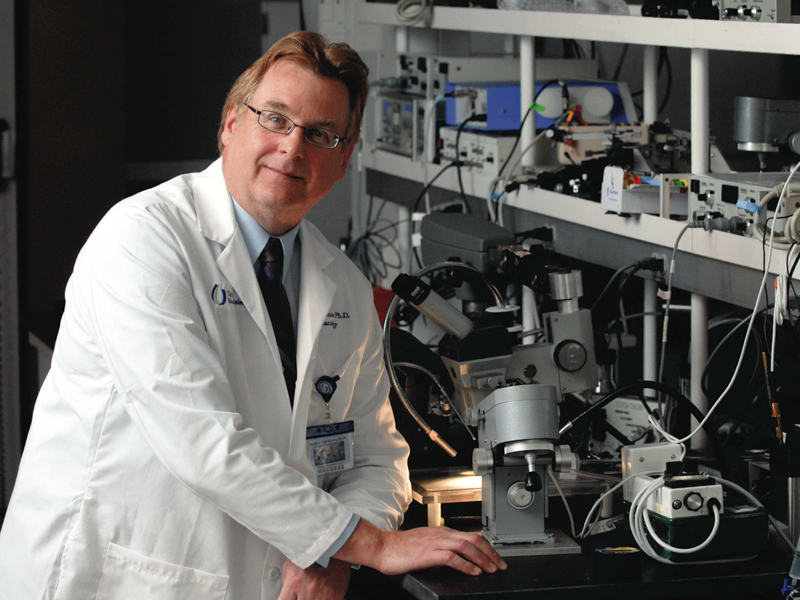 Dr. Richard Roman is pictured in his lab in this 2009 photo.