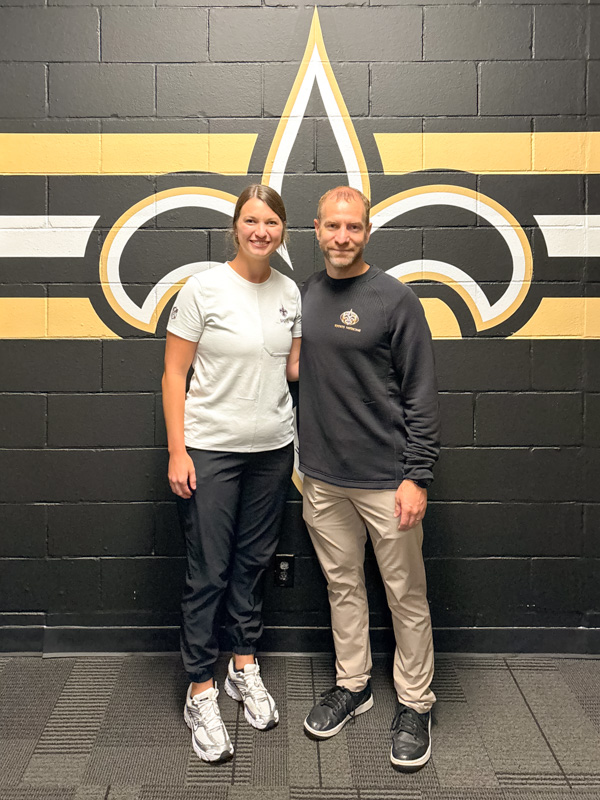 Caylie Blair, left, with Ben Stollbert, director of sports medicine for the New Orleans Saints