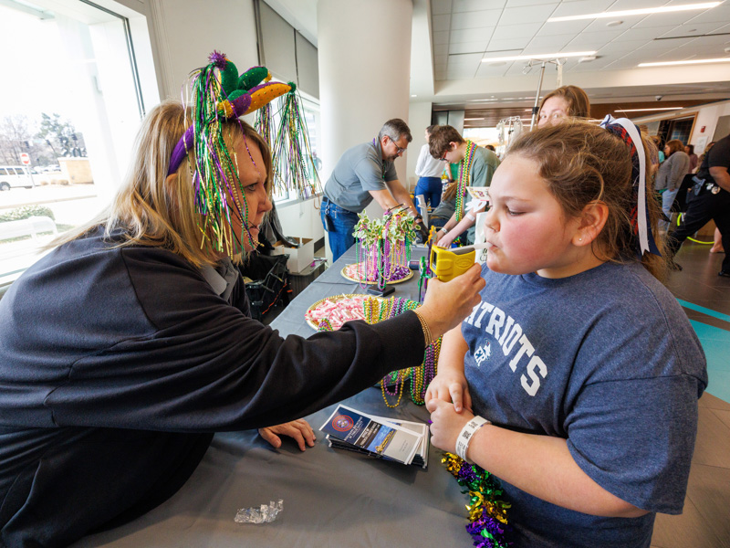 Courtney Hall, 7, of Pelahatchie receives a breathalyzer test from Wendy Hathcock, Mississippi forensics lab. Jay Ferchaud/ UMMC Communications 