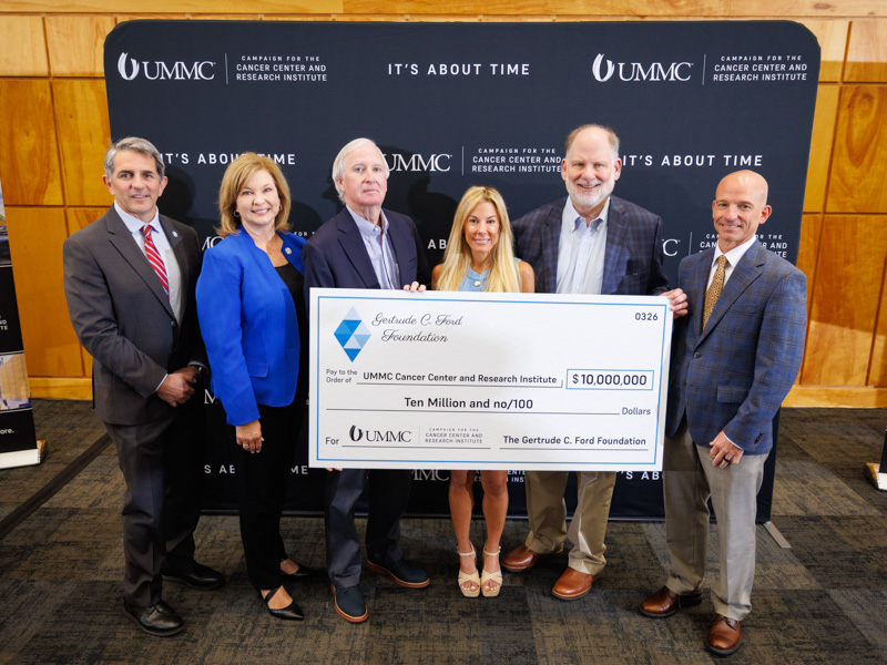 Smiling with a $10 million gift from the Gertrude C. Ford Foundation are, from left, Dr. Rod Rocconi, Ergon Chair for Cancer Research and CCRI director; Dr. LouAnn Woodward, vice chancellor for health affairs; Stephen Sims, president of the Gertrude C. Ford Foundation; Mary Catherine Blackwell, secretary of the Gertrude C. Ford Foundation; John Lewis, treasurer of the Gertrude C. Ford Foundation; and Dr. Alan Jones, associate vice chancellor for health affairs.