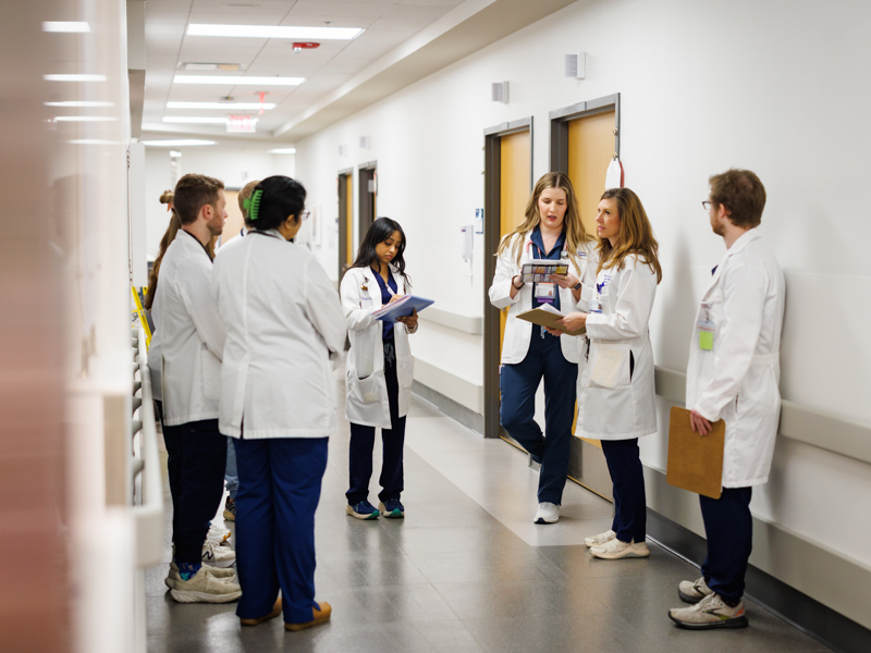 UMMC School of Medicine students learned lessons in note-taking and crisis management during the cyberattack. Rounding in the University Hospital are med students, from left, med students Simranjit Kaur, Landry Smith, Anna Bullock, Lexi Montpelier, residents Dr. William Henry and Dr. Siri Yarlagadda, med student Mary Ellen Owings, attending physician Dr. Michelle Horn, and resident Dr. John Abernathy.