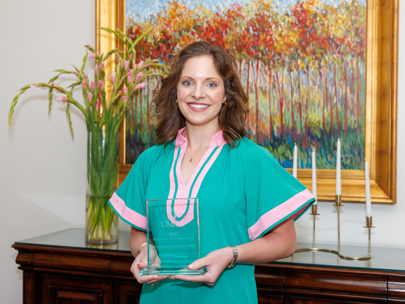 Dr. Stephanie Rizzuto Ricks poses with the Early Career Achievement Award.