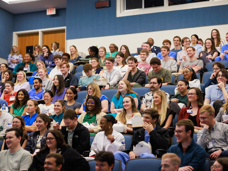 The audience listens intently as Dr. Nathan Tullos challenges them to consider gratitude, humility, passion and hope.