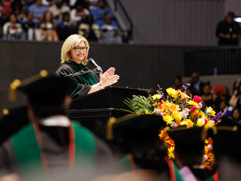 Dr. LouAnn Woodward, vice chancellor for health affairs and dean of the School of Medicine, addresses graduates during UMMC’s 2026 commencement ceremony at the Mississippi Coliseum.