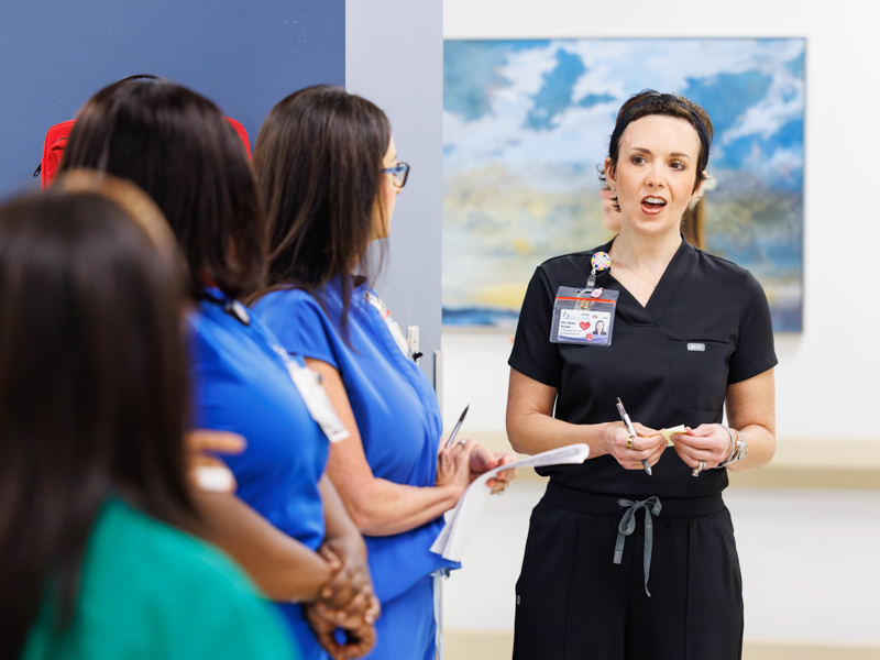 Alice Chaney Herndon talks with nurses during an obstetrics huddle at Wiser Hospital for Women and Infants.