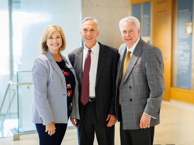 Dr. LouAnn Woodward, vice chancellor for health affairs, joins Dr. John E. Hall, retiring physiologist, and Dr. Dan Jones, former Ole Miss chancellor, during a ceremony honoring Hall's distinguished career and lasting contributions to UMMC. Joe Ellis/ UMMC Communications