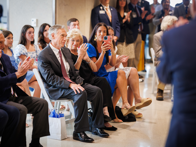 Emotion washes over Dr. Hall as he sees his name displayed on the research building dedicated in his honor. Joe Ellis/ UMMC Communications