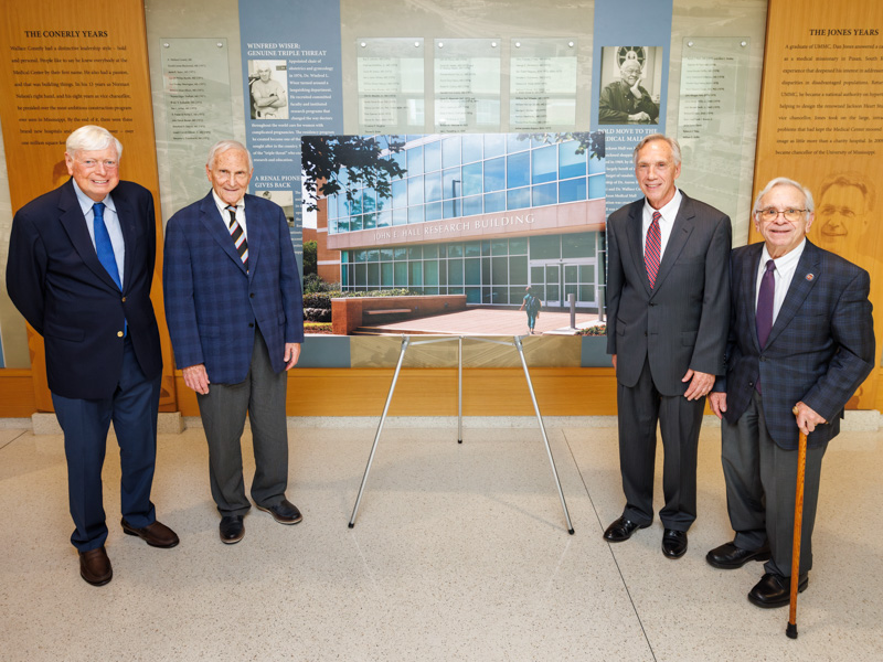 Friends and colleagues from afar joined the celebration. They are, from left, Dr. Christopher Wilcox of Georgetown University; Dr. Allen Cowley, former chair of physiology at Medical College of Wisconsin; Dr. Hall; and Dr. Gabriel Navar, former chair of physiology at Tulane University. Joe Ellis/ UMMC Communications