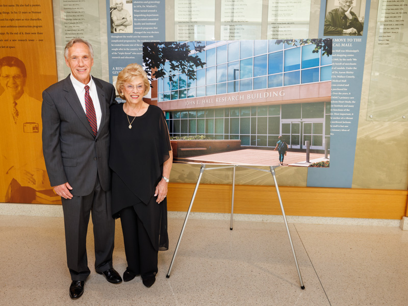Dr. Hall and his wife, Becky, take in the moment after the unveiling. Joe Ellis/ UMMC Communications