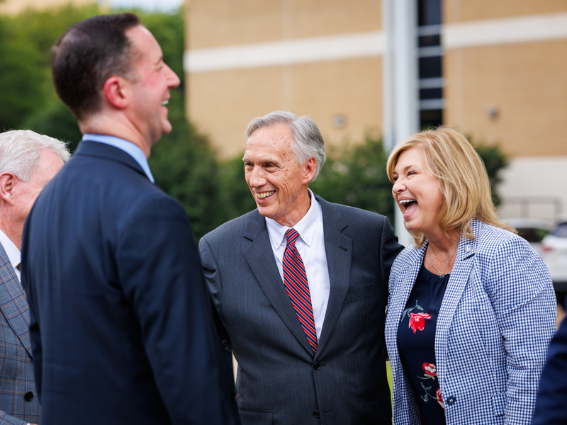 Dr. Dan Jones, left, Dr. Brian Rutledge, Dr. John E. Hall and Dr. LouAnn Woodward continue the joyful celebration during Dr. Hall's retirement tribute. Joe Ellis/ UMMC Communications