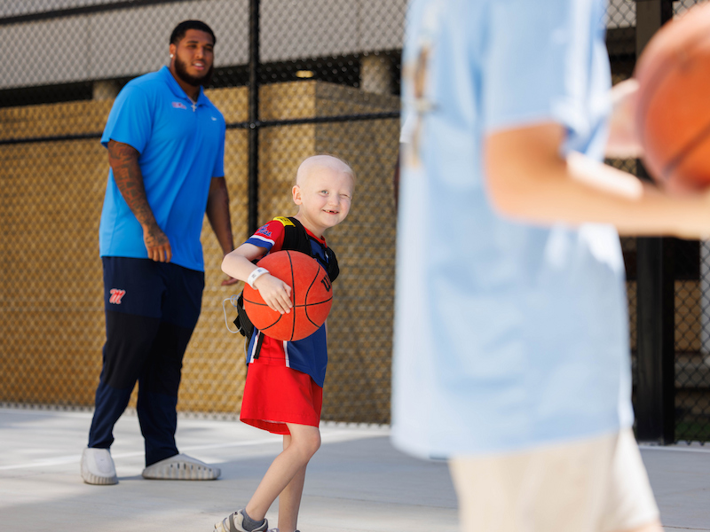 Ledger Smith plays basketball with University of Mississippi football team including offensive lineman Terez Davis