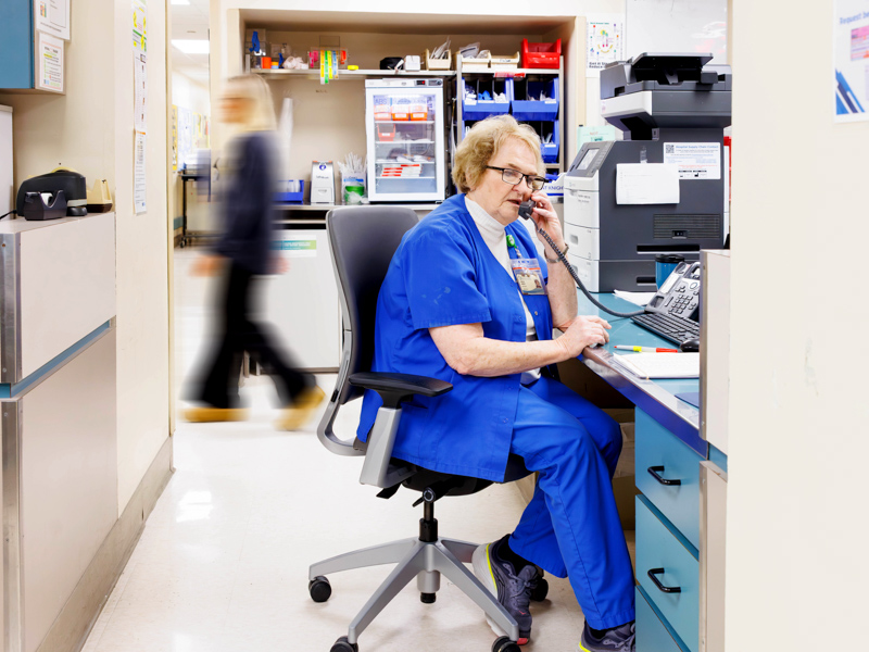 Lindsey takes a call during a 12-hour shift in the SICU.