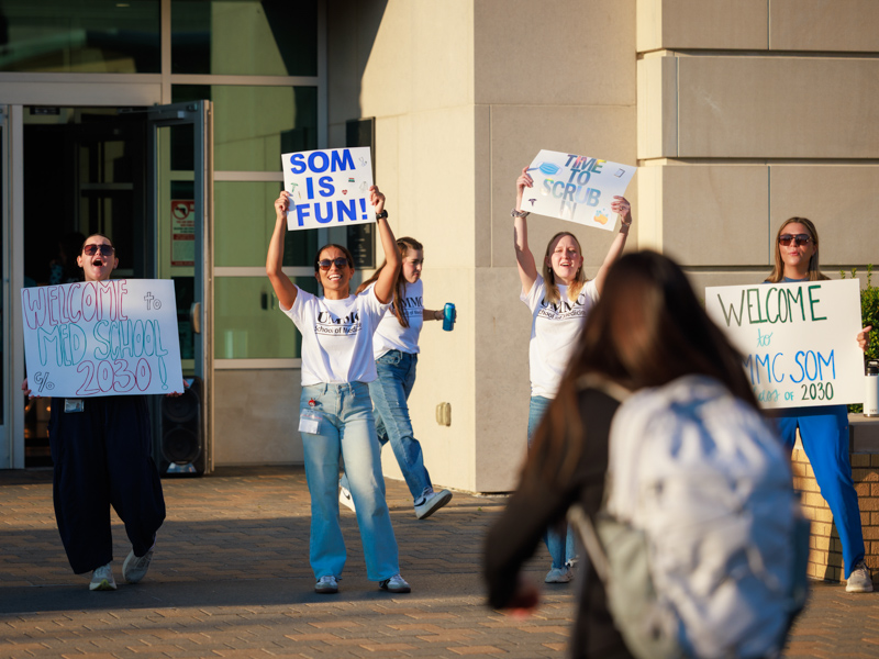 Second-year medical students greet incoming students on the first day of medical school. Joe Ellis/ UMMC Communications