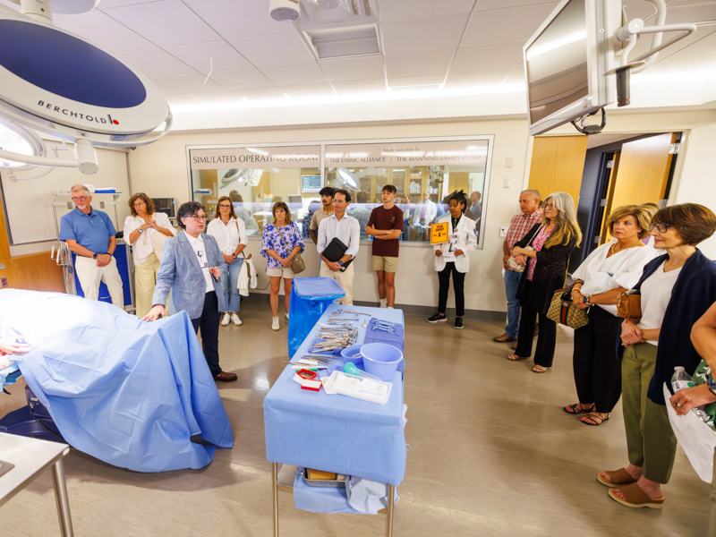 Dr.Norma Ojeda, chair of advanced biomedical education, talks with parents of first-year medical students in the SIM lab during family day. Melanie Thortis/ UMMC Communications