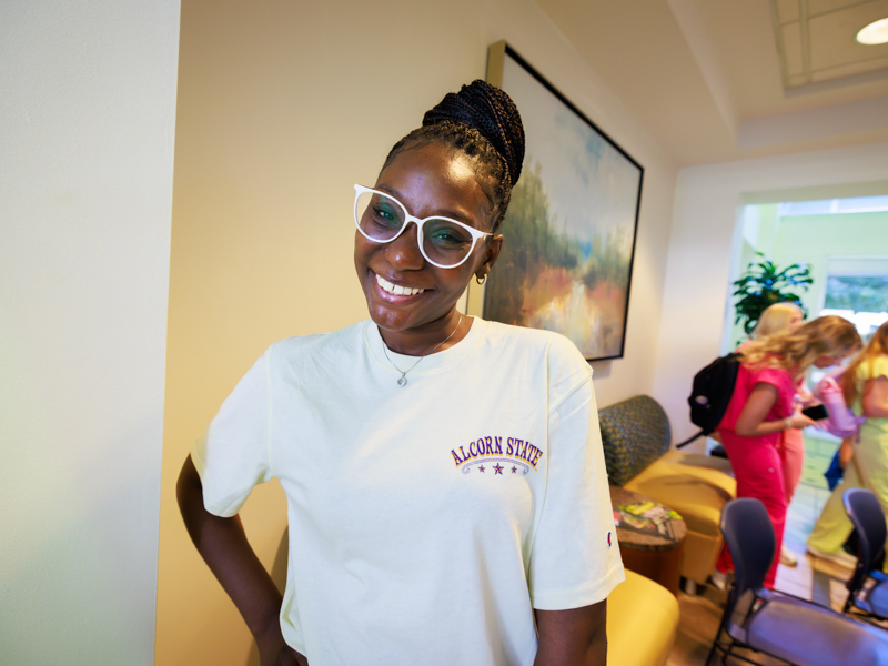 Nursing student Richandriana Simmons is all smiles at the School of Nursing on Monday where coffee, pastries and other treats were offered. Joe Ellis/ UMMC Communications