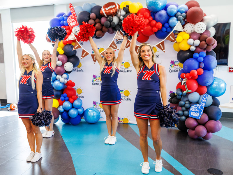University of Mississippi cheerleaders brought their school spirit by performing a cheer at the state's only children's hospital during Tailgating with Friends.