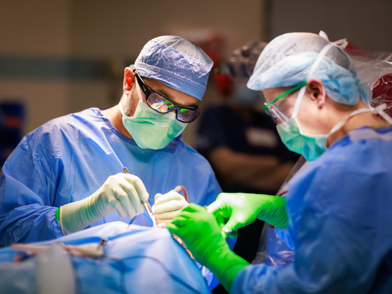 Dr. Omar Chohan, associate professor of neurosurgery, implanting neurostimulator device in patient James Canfield.