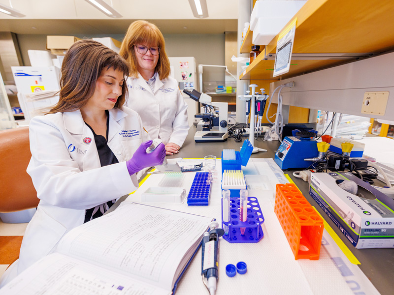 MD-PhD student Madison Hansen, left, conducts laboratory research alongside her mentor, Dr. Erin Taylor, assistant professor of physiology and biophysics.