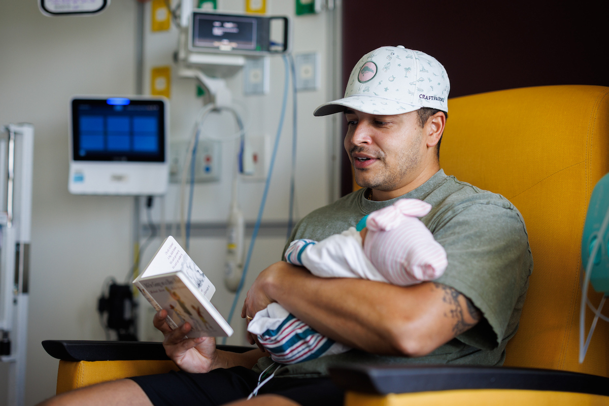 Mercy Bunch, of Sumrall enjoys being read to by her dad, Tyler.