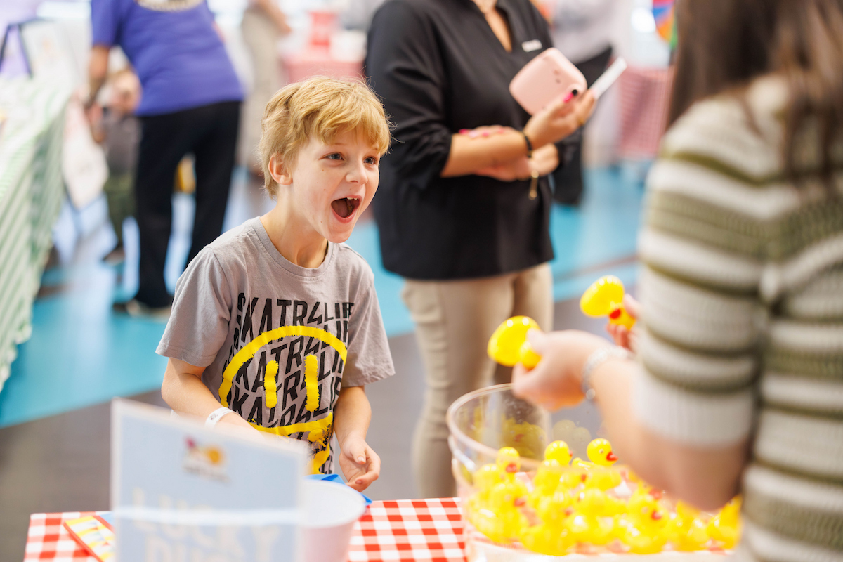 Colton Russell, 6, of Vicksburg cannot believe his luck after picking the winning duck.
