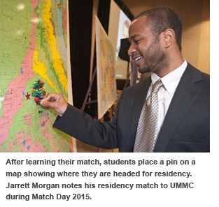 After learning their match, students place a pin on a map showing where they are headed for residency. Jarrett Morgan notes his residency match to UMMC during Match Day 2015.
