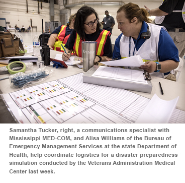 Samantha Tucker, right, a communications specialist with Mississippi MEO-COM, and Alisa Williams of the Bureau of Emergency Management Services at the state Department of Health, help coordinate logistics for a disaster preparedness simulation conducted by the Veterans Administration Medical Center last week.