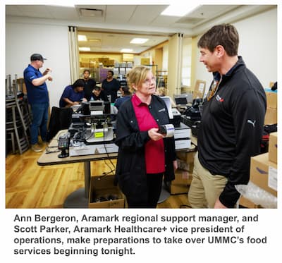 Ann Bergeron, Aramark regional support manager, and Scott Parker, Aramark Healthcare+ vice president of operations, make preparations to take over UMMC’s food services beginning tonight.