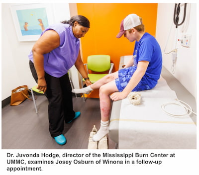 Dr. Juvonda Hodge, director of the Mississippi Burn Center at UMMC, examines Josey Osburn of Winona in a follow-up appointment.