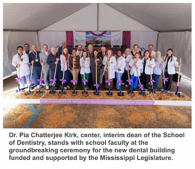 Dr. Pia Chatterjee Kirk, center, interim dean of the School of Dentistry, stands with school faculty at the groundbreaking ceremony for the new dental building funded and supported by the Mississippi Legislature.