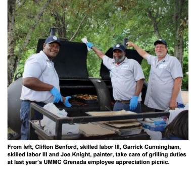 From left, Clifton Benford, skilled labor III, Garrick Cunningham, skilled labor III and Joe Knight, painter, take care of grilling duties at last year’s UMMC Grenada employee appreciation picnic.