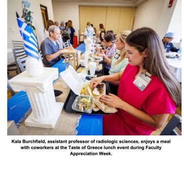 Kala Burchfield, assistant professor of radiologic sciences, enjoys a meal with coworkers at the Taste of Greece lunch event during Faculty Appreciation Week.