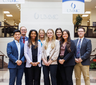 A group photo of the UMMC-based pharmacy residents in the lobby of University Hospital