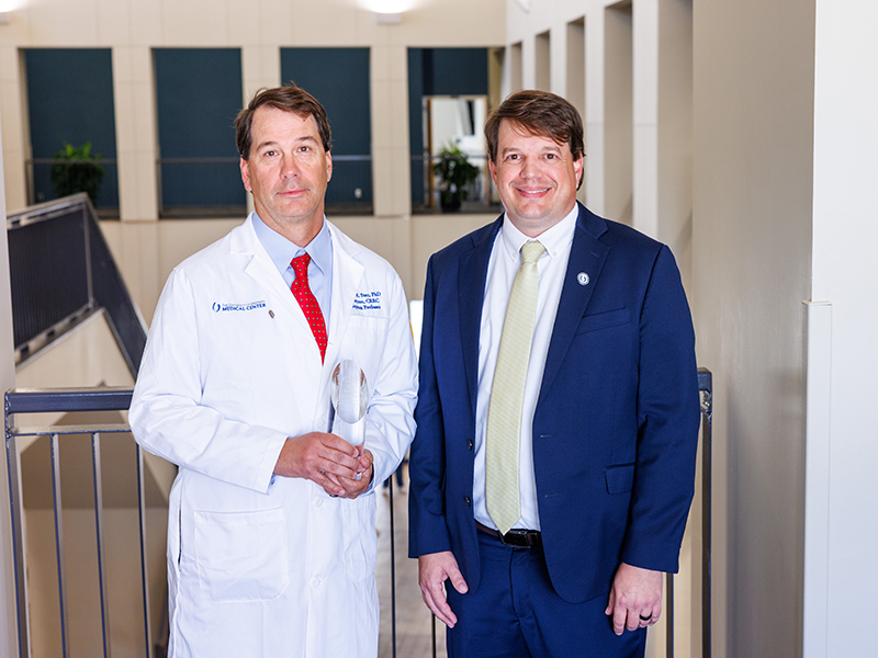 Dr. Davic Stec with Dr. Gene Bidwell inside the Nelson Student Union.