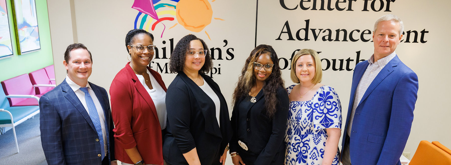 Six smiling members of the Center for the Advancement of Youth.