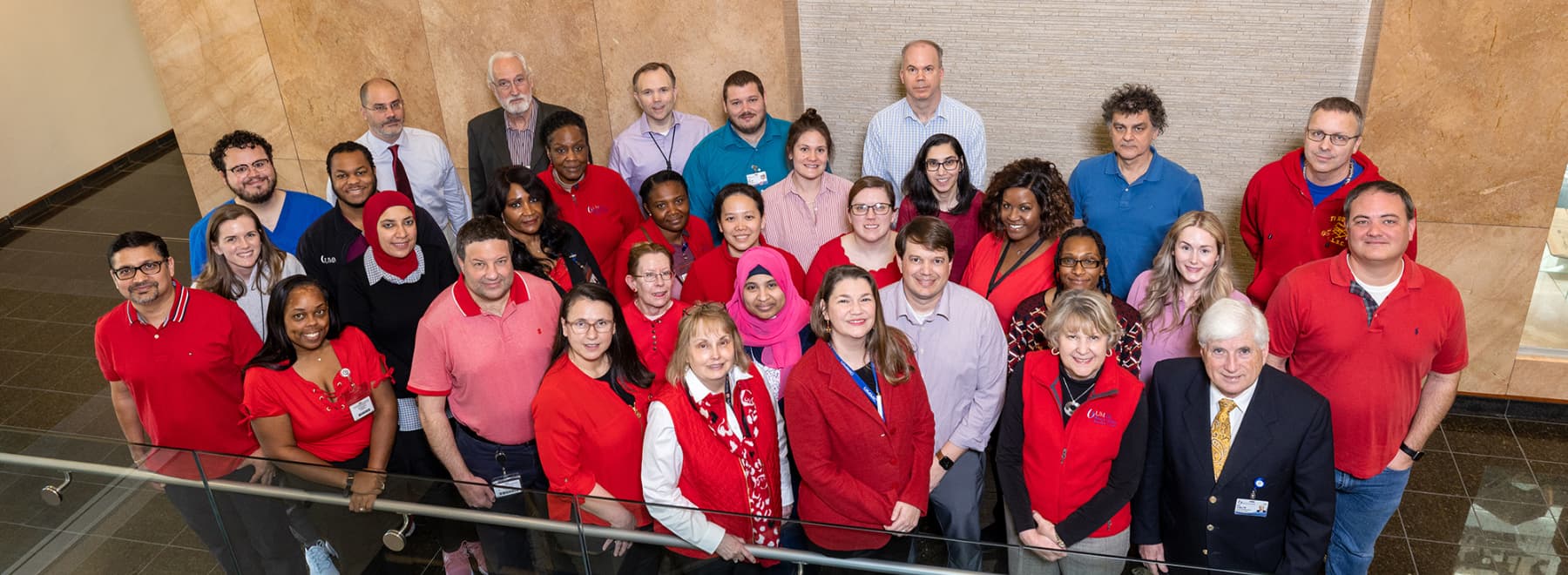 Group photo of Women's Health Research Center staff dressed in red