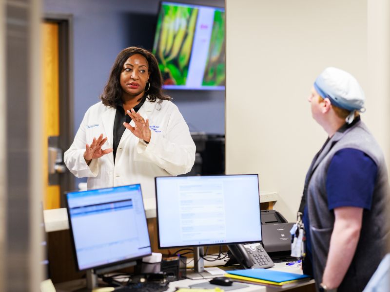 Dr. Hodge and a clinician in conversation inside the UMMC Mississippi Burn Center.