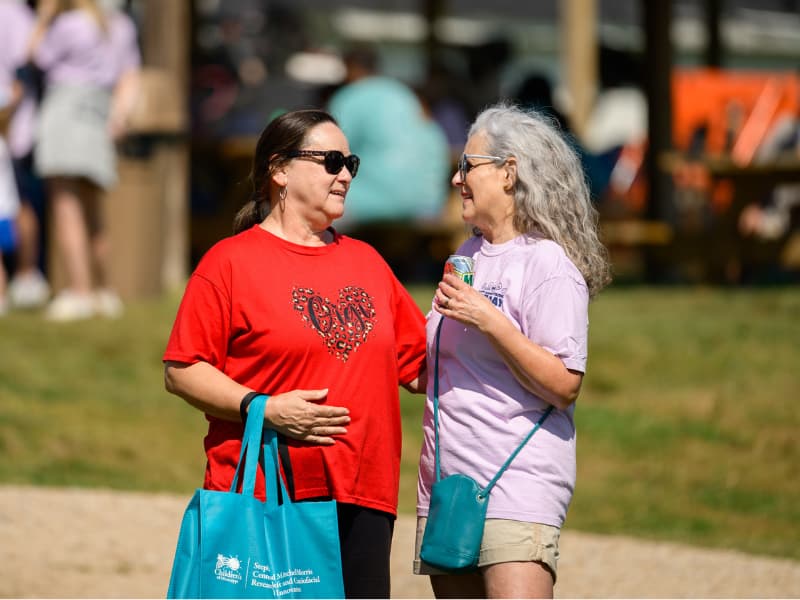 Two women talk during Family Fun Day 2026.