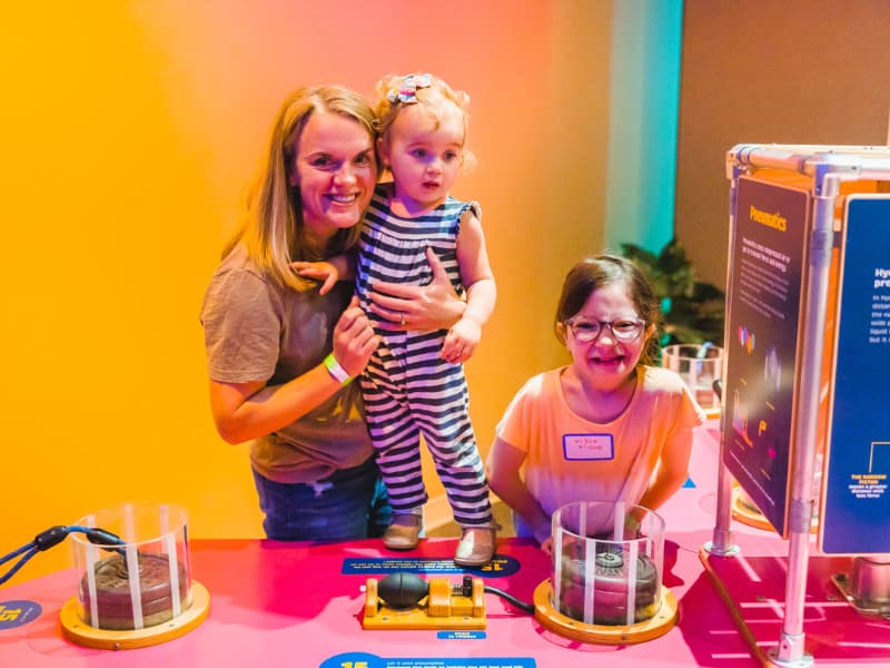 A family enjoys one of the displays at Family Fun Day