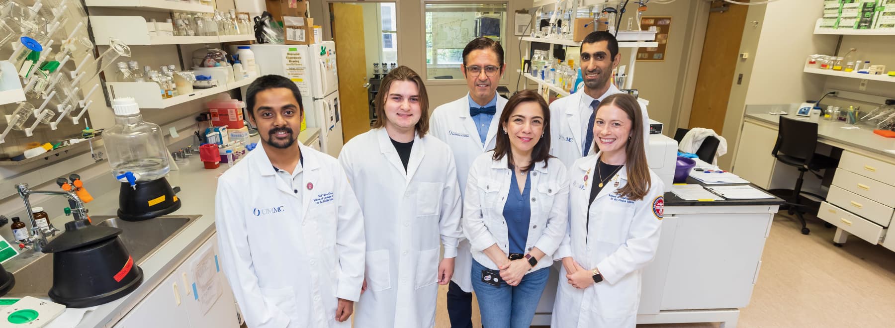Group photo of Molecular Center of Health and Disease team members in lab.