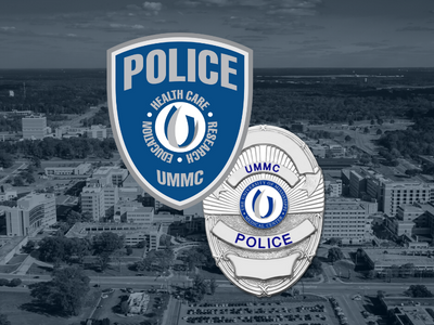 UMMC Police logo over campus photo