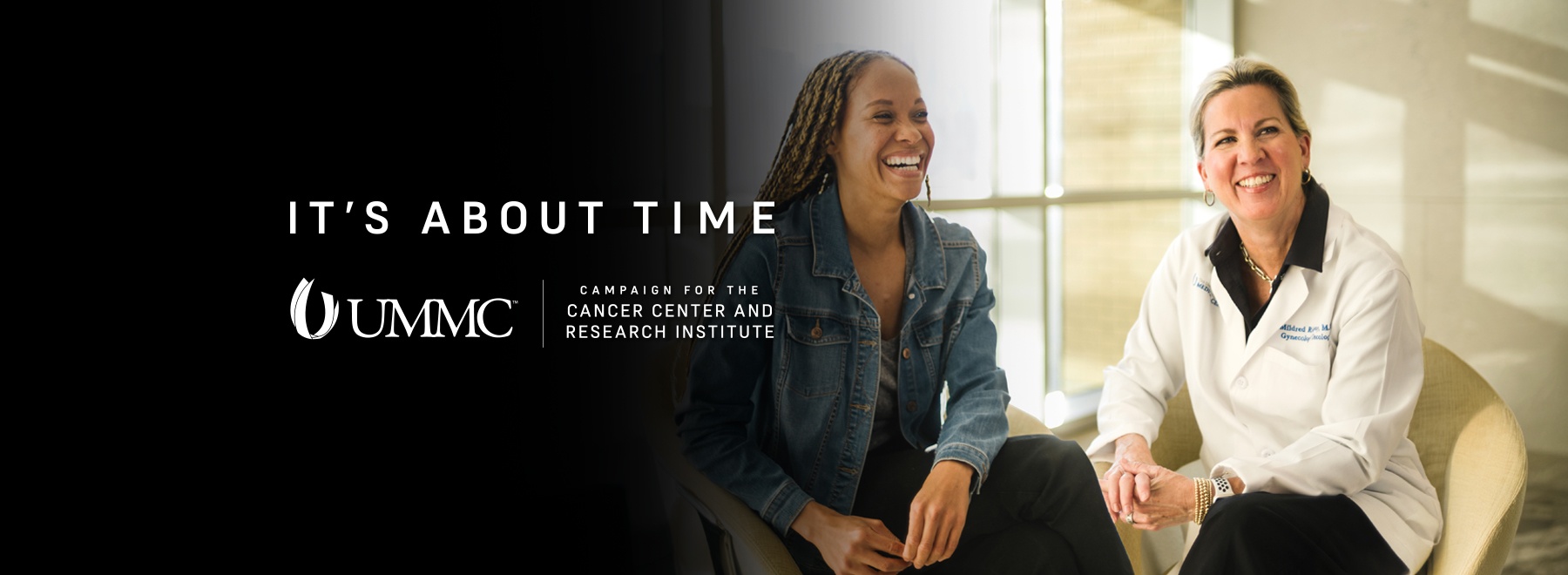 Patient and provider laughing together.