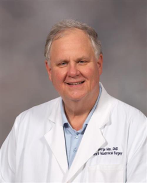George W. May  Jr., DMD