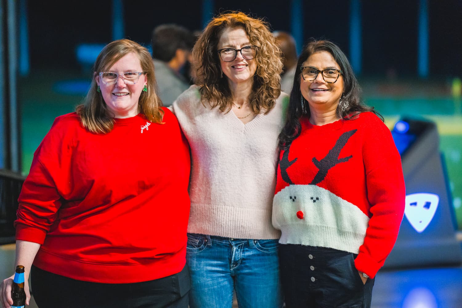 Lauren McMurtray, Susan Roberts and Dr. Seema Singh smile at the CCRI holiday gathering.