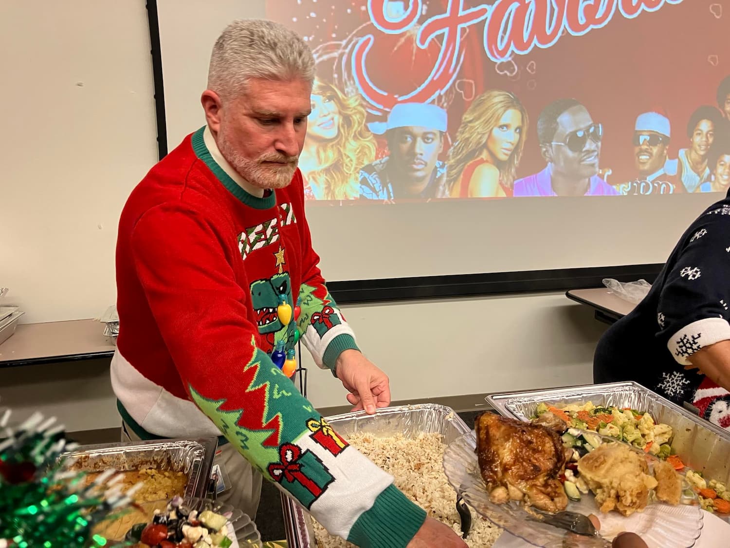 Dr. Michael Garrett helps serve lunch.