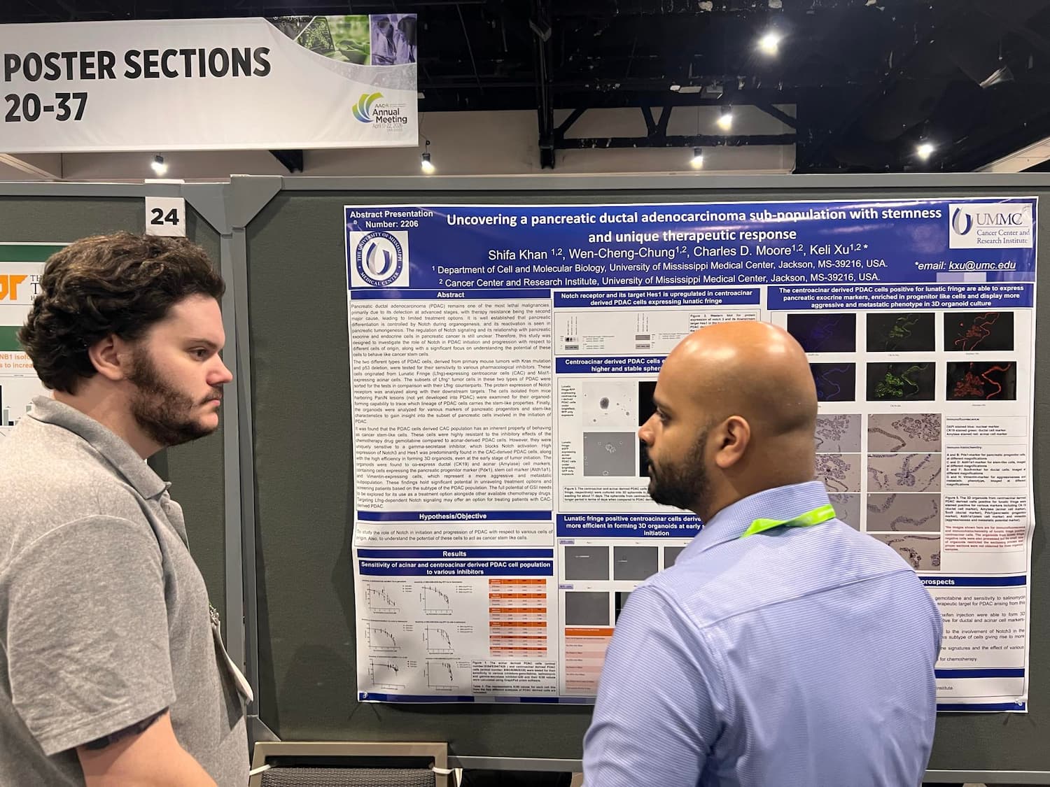 Research is presented by graduate student Charles Moore, left, at the AACR Annual Meeting in San Diego.